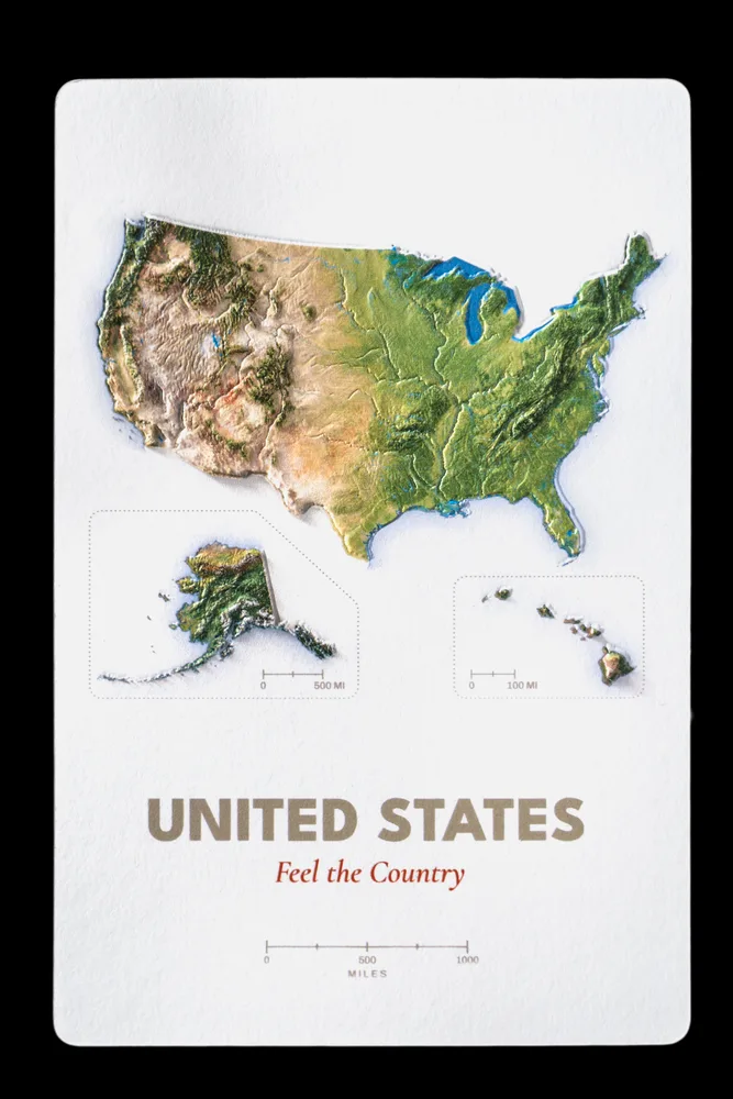 United States production proof photographed straight on, with Alaska and Hawaii inset below the raised continental terrain