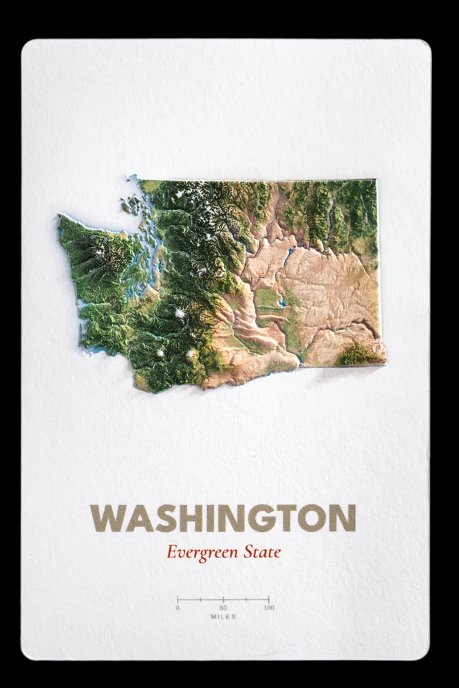 Washington production proof photographed straight on, showing the raised Cascades and Olympic ranges above the printed state name